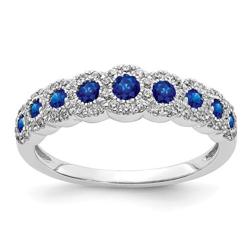14k white gold ring with diamonds and sapphires, polished jewelry ring showcasing elegant gemstone details.