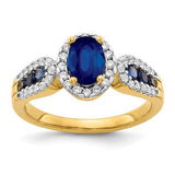 14k gold ring with a large oval sapphire and diamonds, showcasing elegant jewelry design by Solomon Jewelers