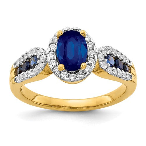 14k gold ring with a large oval sapphire and diamonds, showcasing elegant jewelry design by Solomon Jewelers