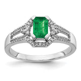 14k white gold ring featuring diamonds and emeralds, elegant jewelry piece with intricate design and sparkling gemstones.