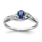 14k white gold oval sapphire and diamond ring with elegant design, crafted by Solomon Jewelers.