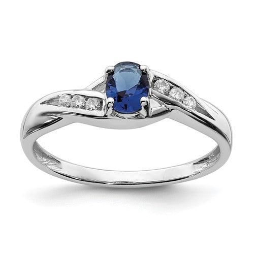 14k white gold oval sapphire and diamond ring with elegant design, crafted by Solomon Jewelers.