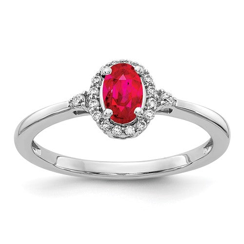 14k white gold oval ruby and diamond halo ring with intricate detailing, perfect for elegant jewelry collection.