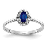 14k white gold diamond and oval sapphire halo ring, showcasing sparkling gemstones and elegant jewelry design