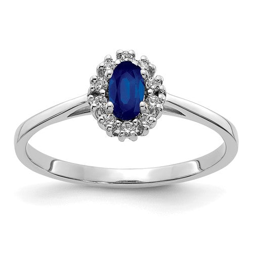 14k white gold diamond and oval sapphire halo ring, showcasing sparkling gemstones and elegant jewelry design