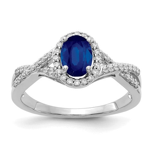 14k white gold diamond and sapphire oval halo ring, elegant jewelry piece with sparkling gemstones and intricate design.