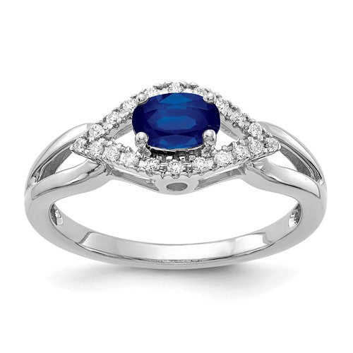 14k white gold ring with diamonds and sapphires, showcasing elegant jewelry design with sparkling gemstones.