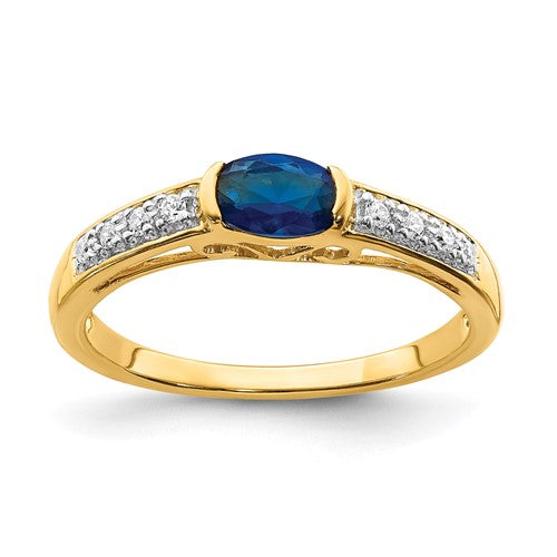 14k gold oval east-west sapphire and diamond ring, showcasing a stunning jewelry piece with intricate design and sparkling gemstones.