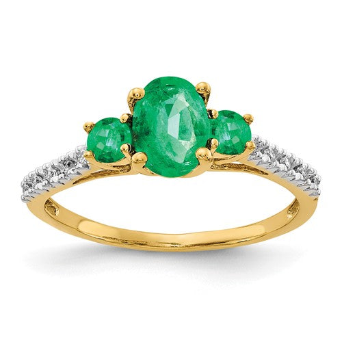 14k gold oval emerald and diamond ring featuring a central emerald gemstone surrounded by sparkling diamonds.