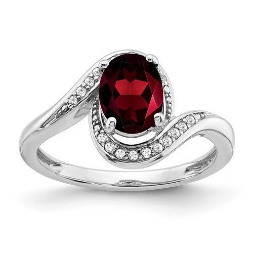 14k white gold oval garnet and diamond bypass ring showcasing a vibrant red garnet and sparkling diamonds in a sleek design