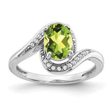 14k white gold oval peridot and diamond bypass ring, showcasing a vibrant green gemstone with sparkling accents.