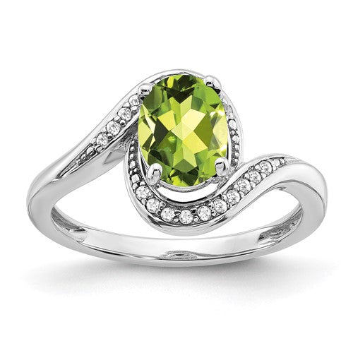 14k white gold oval peridot and diamond bypass ring, showcasing a vibrant green gemstone with sparkling accents.