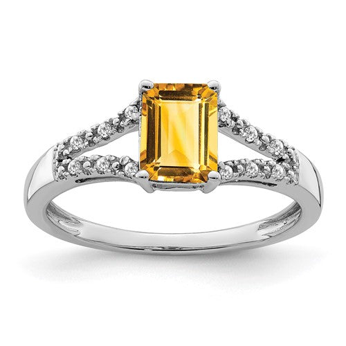 14k white gold emerald-cut citrine and diamond ring, showcasing a vibrant yellow gemstone accented with sparkling diamonds.