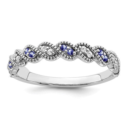 14k white gold Tanzanite and diamond twist ring with intricate design, featuring vibrant blue gemstones and sparkling accents.