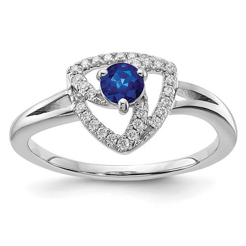 14k white gold diamond and blue sapphire triangle ring displaying sparkling gemstones and sleek design.