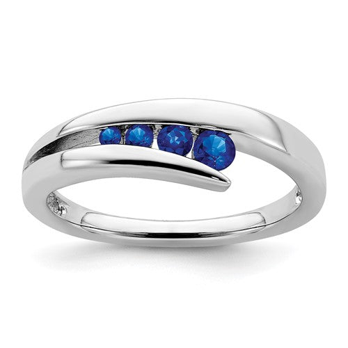 14k white gold sapphire 4-stone ring with detailed band design, showcasing elegant jewelry craftsmanship.