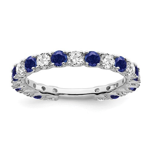 14k white gold created sapphire and diamond ring featuring a band with sparkling gemstones and elegant design.