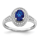 14k white gold oval sapphire and diamond halo ring showing the detailed design and sparkling gemstones.