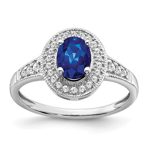 14k white gold oval sapphire and diamond halo ring showing the detailed design and sparkling gemstones.