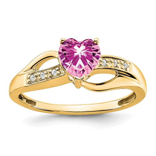 14k created pink sapphire and diamond heart ring from Solomon Jewelers, showcasing pink sapphires and sparkling diamonds in a romantic design.