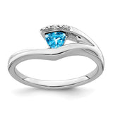 14k white gold ring featuring a trillion blue topaz gemstone and diamond accents, elegant jewelry by Solomon Jewelers