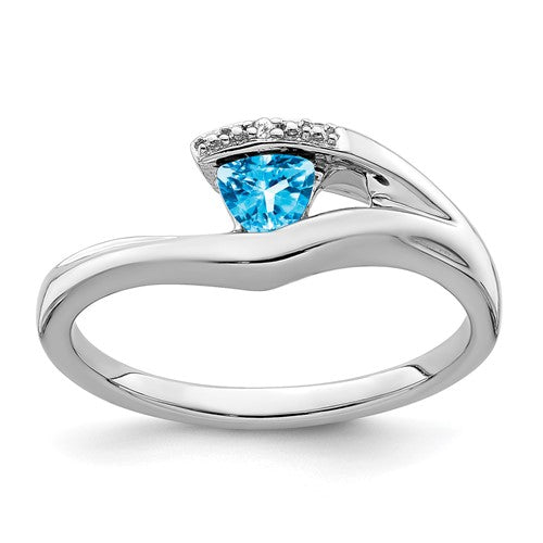 14k white gold ring featuring a trillion blue topaz gemstone and diamond accents, elegant jewelry by Solomon Jewelers