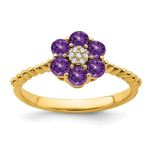 14k gold amethyst and diamond floral ring showcasing a vibrant purple gemstone and sparkling diamonds in a delicate floral design.