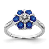 14k white gold sapphire and diamond floral ring showcasing intricate design and sparkling gemstones.