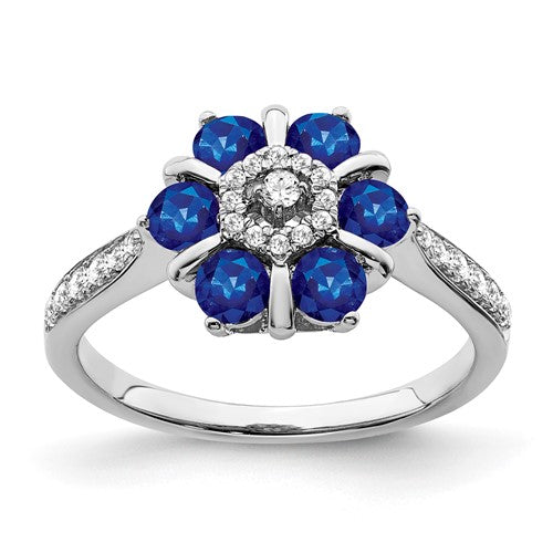 14k white gold sapphire and diamond floral ring showcasing intricate design and sparkling gemstones.
