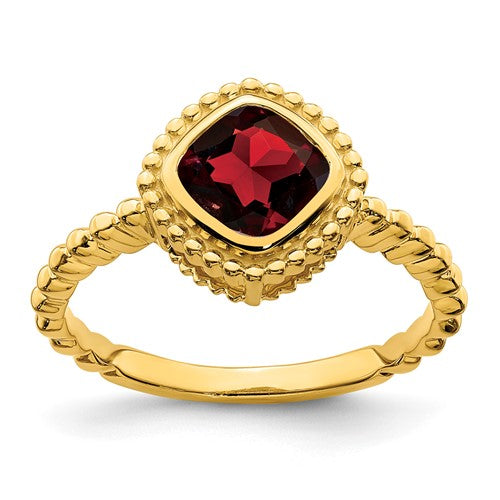 14k gold cushion garnet ring featuring a vibrant red gemstone set in a classic jewelry ring design.