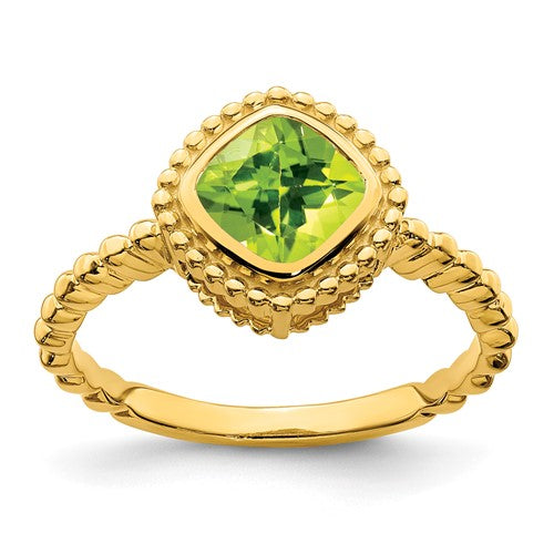 14k cushion peridot ring featuring a vibrant green peridot gemstone set in a gold band, designed by Solomon Jewelers.
