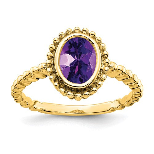 14k gold oval amethyst ring with a decorative band, featuring a large purple amethyst gemstone set in Solomon Jewelers jewelry.