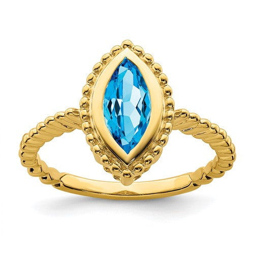 14k gold marquise blue topaz ring featuring a sparkling blue gemstone set in elegant jewelry ring design.