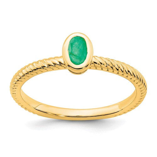 14k gold oval bezel emerald ring featuring a vibrant green emerald gemstone set in a Solomon Jewelers ring design.