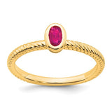 14k gold oval bezel ruby ring from Solomon Jewelers featuring a vibrant red ruby set in a classic gold band.