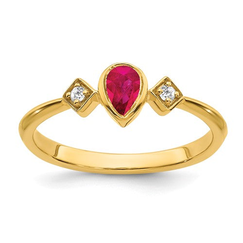 14k gold pearl bezel ring with ruby and diamond accents, elegant jewelry piece from Solomon Jewelers.