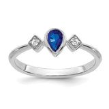 14k white gold ring with pear-shaped bezel sapphire and diamond accents, elegant jewelry piece from Solomon Jewelers