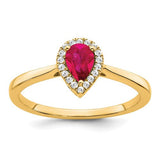 14k gold pear-shaped ruby and diamond halo ring with intricate detailing, crafted by Solomon Jewelers.