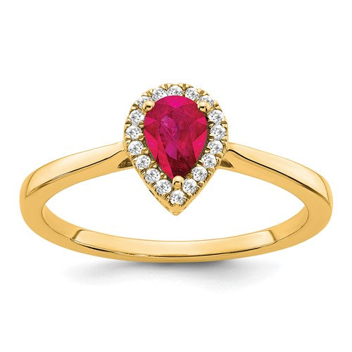 14k gold pear-shaped ruby and diamond halo ring with intricate detailing, crafted by Solomon Jewelers.