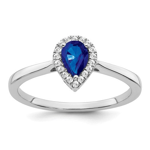14k white gold pear sapphire and diamond halo ring showing the elegant design and sparkling gemstones.