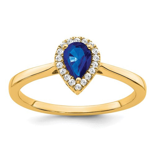 14k gold pear sapphire and diamond halo ring with intricate design, showcasing a stunning center gemstone and sparkling accents.