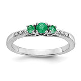 14k white gold emerald and diamond three-stone ring featuring a central emerald flanked by diamonds, elegant jewelry by Solomon Jewelers