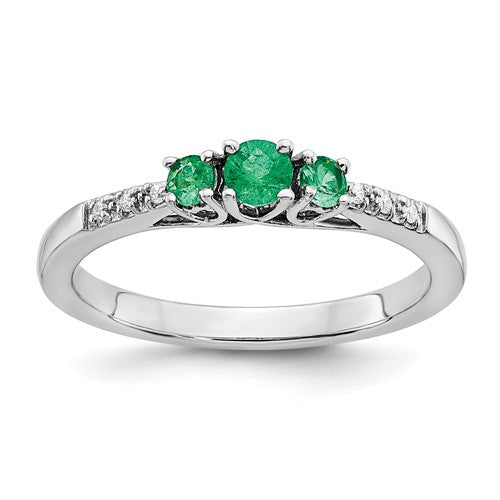 14k white gold emerald and diamond three-stone ring featuring a central emerald flanked by diamonds, elegant jewelry by Solomon Jewelers