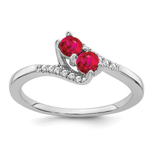 14k white gold ruby and diamond 2-stone bypass ring showcasing vibrant gemstones and elegant design.