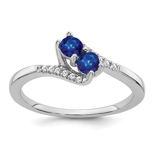 14k white gold sapphire and diamond 2-stone bypass ring, showcasing elegant jewelry design with sparkling gemstones.