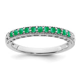 14k white gold emerald and diamond ring featuring a central emerald gemstone surrounded by sparkling diamonds.