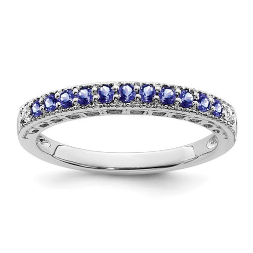 14k white gold Tanzanite and diamond ring featuring a central Tanzanite gemstone and diamond accents, elegant jewelry ring.