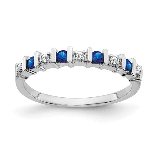 14k white gold sapphire and diamond ring featuring a central sapphire gemstone and sparkling diamonds, crafted by Solomon Jewelers.