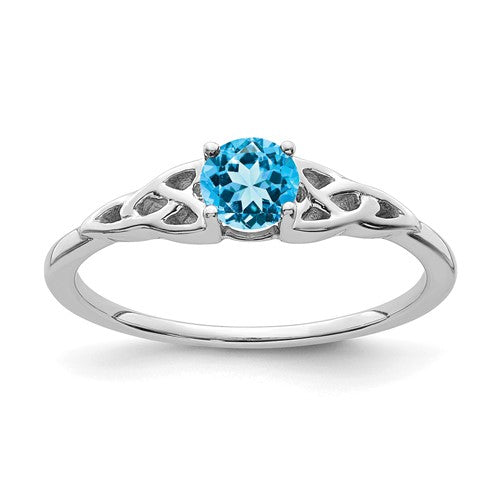 14K white gold blue topaz Celtic knot ring with intricate design, crafted by Solomon Jewelers.