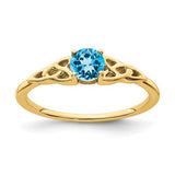 14K gold blue topaz Celtic knot ring with intricate design, crafted by Solomon Jewelers.